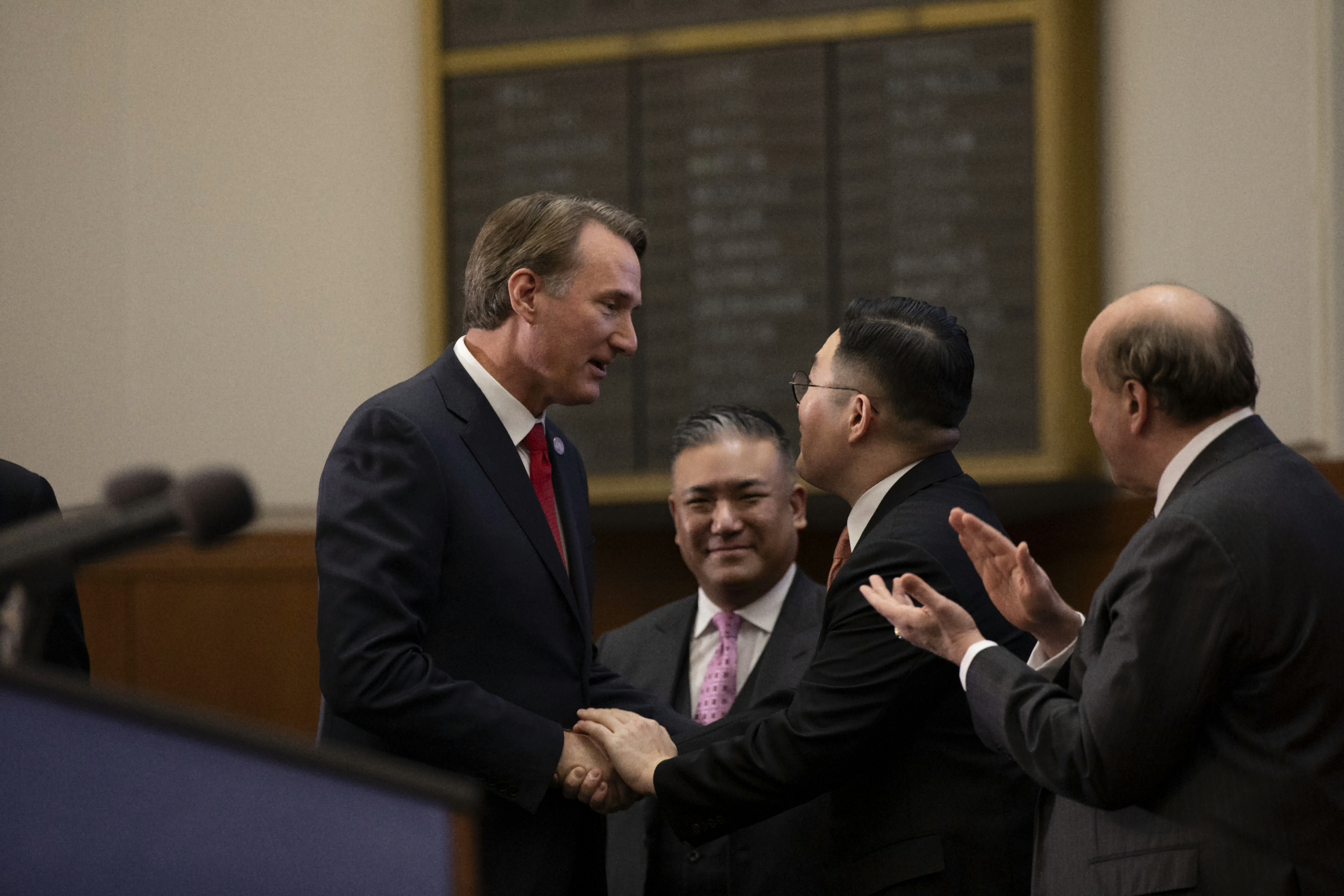 Virginia Gov. Glenn Youngkin with Bon-Kyu Koo President & CEO, LS Cable & System; (background) Paul Dabbar, U.S. Deputy Secretary of Commerce, and Patrick Y. Shim, Managing Director, LS Cable & System