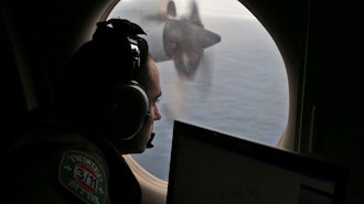 Flight officer Rayan Gharazeddine scans the water in the southern Indian Ocean off Australia from a Royal Australian Air Force AP-3C Orion during a search for the missing Malaysia Airlines Flight MH370 on March 22, 2014.