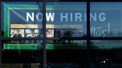 A hiring sign is displayed at a grocery store in Northbrook, Ill., Jan. 21, 2025.