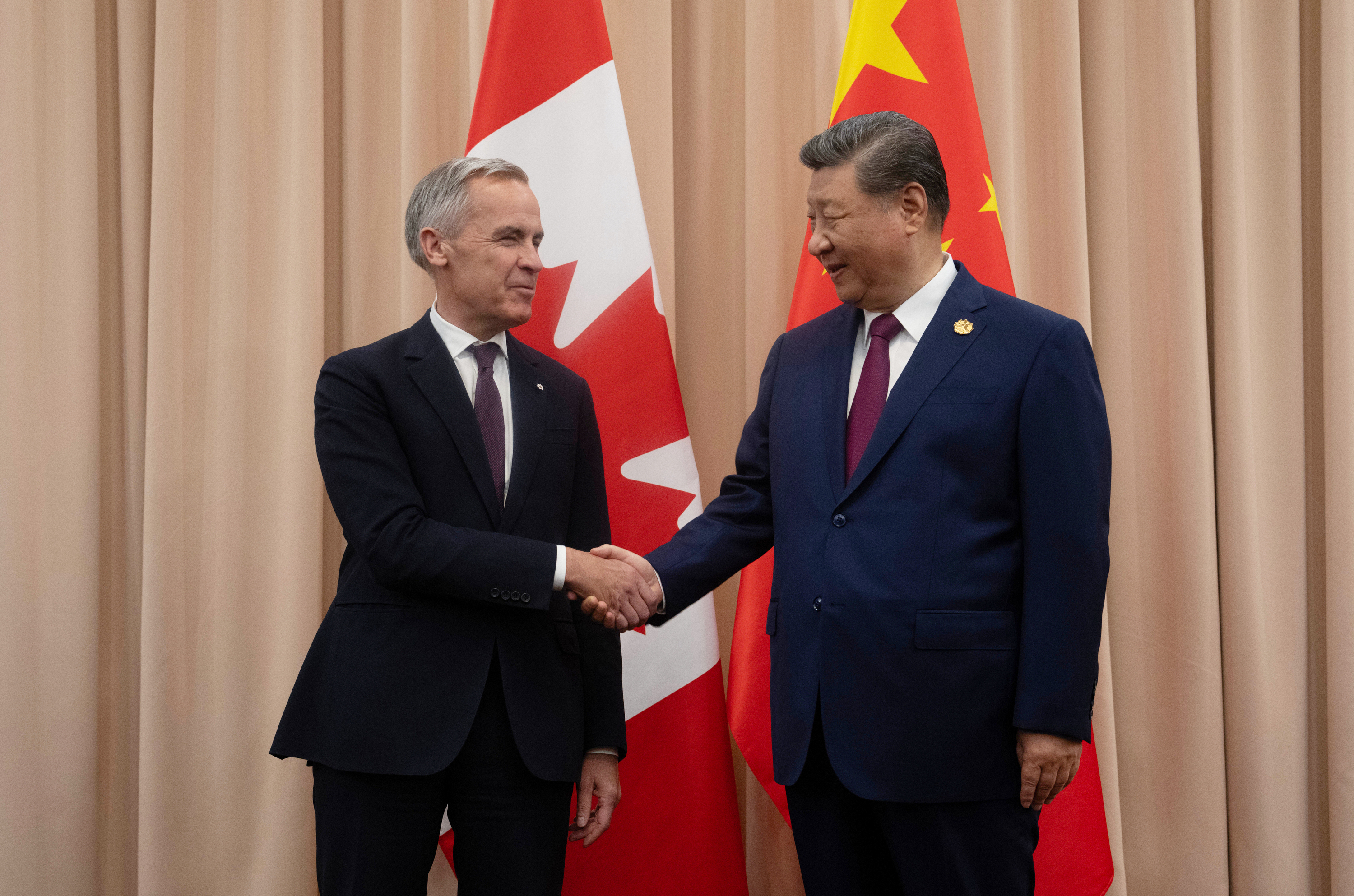 Canadian Prime Minister Mark Carney, left, shakes hands with Chinese President Xi Jinping at the start of a meeting in Gyeongju, South Korea, Oct. 31, 2025.