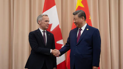 Canadian Prime Minister Mark Carney, left, shakes hands with Chinese President Xi Jinping at the start of a meeting in Gyeongju, South Korea, Oct. 31, 2025.