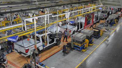 Employees work on the assembly line at the Ford River Rogue complex, Tuesday, Jan. 13, 2026, in Dearborn, Mich.