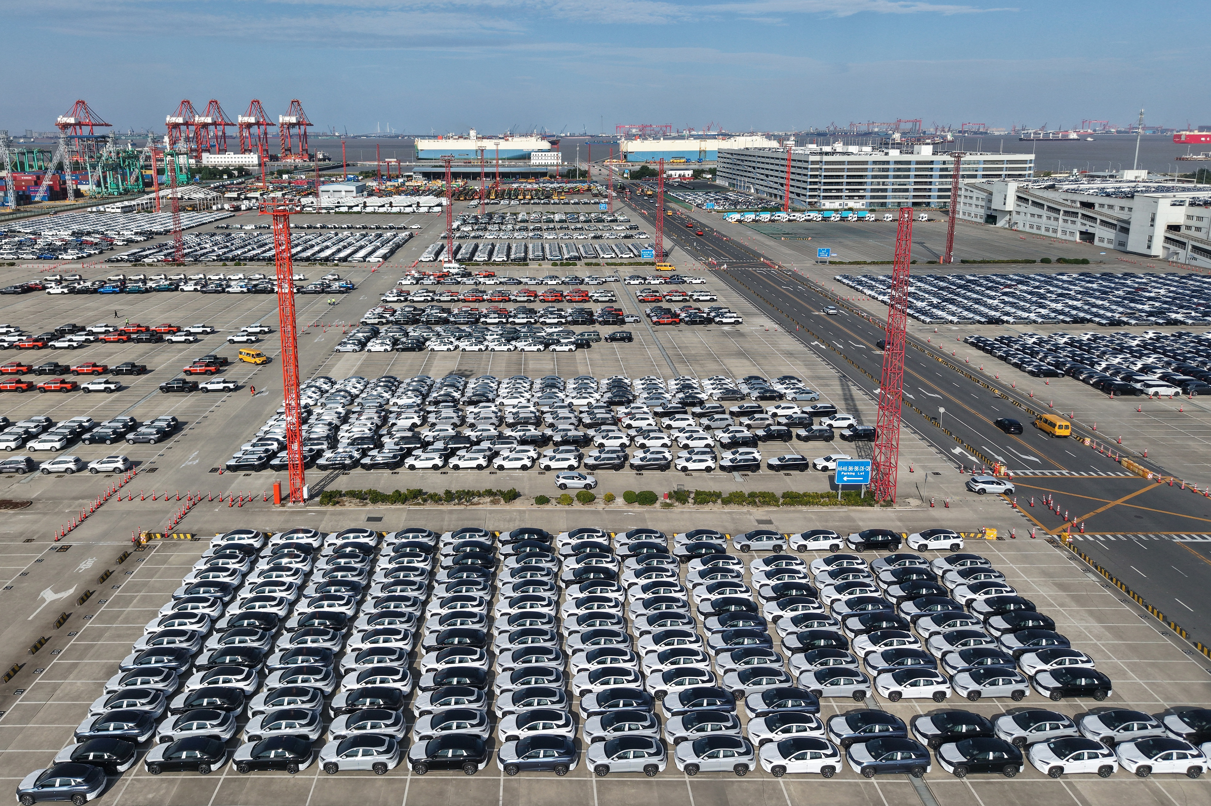 Aerial view of new cars waiting for shipment at a port in Shanghai, China, Wednesday, Jan. 14, 2026.