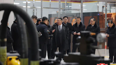 In this photo provided by the North Korean government, North Korean leader Kim Jong Un, center, visits the Ryongsong Machine Complex in North Korea Monday, Jan. 19, 2026. Independent journalists were not given access to cover the event depicted in this image distributed by the North Korean government. The content of this image is as provided and cannot be independently verified. Korean language watermark on image as provided by source reads: 'KCNA' which is the abbreviation for Korean Central News Agency.