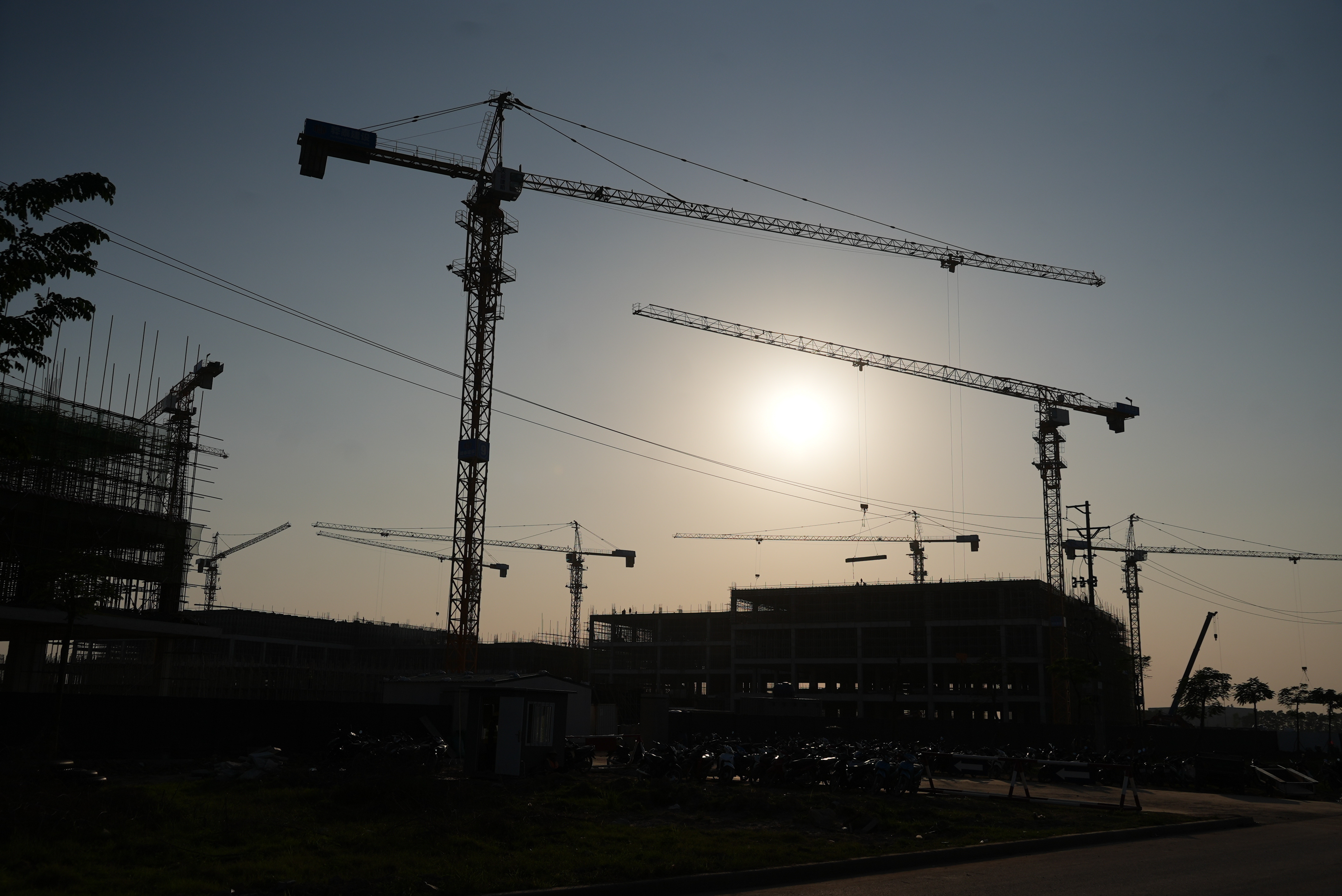 Multiple cranes are placed at a construction site at Yen Phong Industrial Park in Bac Ninh province, Vietnam, on Dec. 26, 2025.
