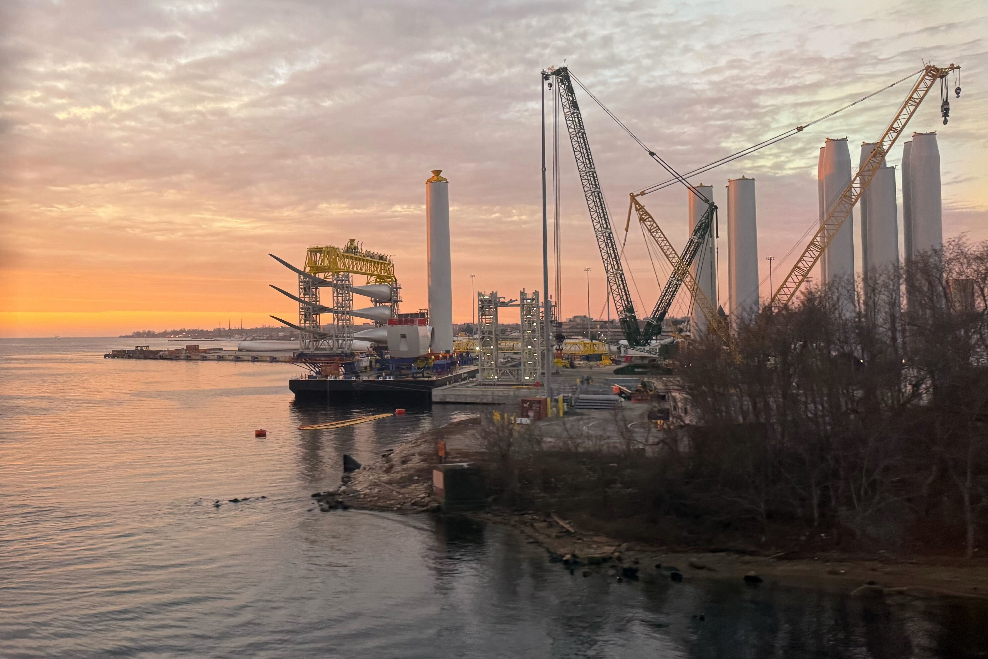 Blades and turbine bases for offshore wind sit at a staging area at New London State Pier, Wednesday, Jan. 14, 2026, in New London, Conn.