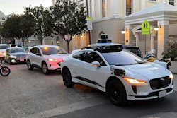 A Waymo driverless taxi stops on a street in San Francisco on Feb. 15, 2023.