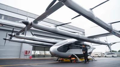 A mechanic moves out a 5-ton class eVTOL aircraft from AutoFlight hanger in Shanghai, China, on Feb. 24, 2026.