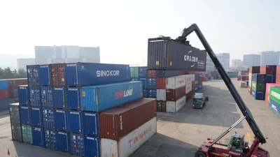 A crane unloads a container at the Uiwang ICD Terminal in Uiwang, South Korea, Thursday, March 12, 2026.