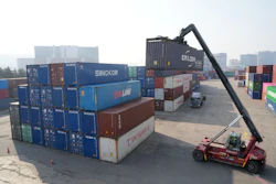 A crane unloads a container at the Uiwang ICD Terminal in Uiwang, South Korea, Thursday, March 12, 2026.