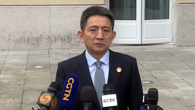 Chinese lead trade negotiator Li Chenggang gives a press conference at the Organization for Economic Cooperation and Development headquarters, March 16, 2026, Paris.