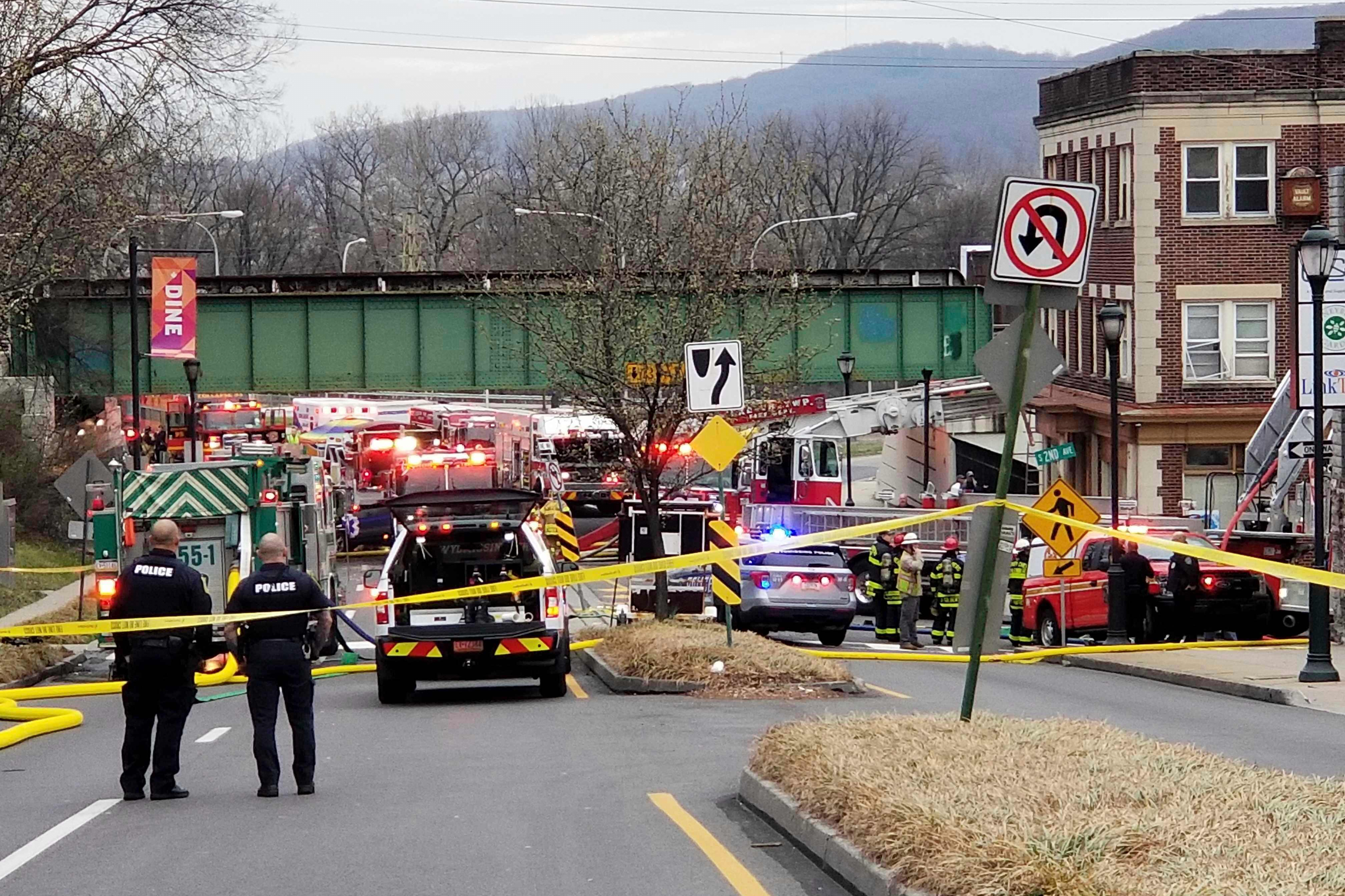 Emergency personnel work at the site of a deadly explosion at a chocolate factory in West Reading, Pa., on March 25, 2023.