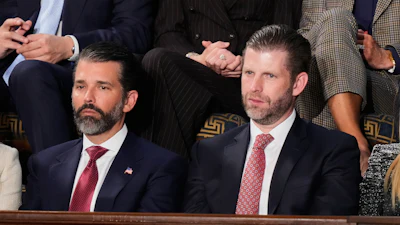 Donald Trump Jr. and Eric Trump listen to President Donald Trump's State of the Union address to a joint session of Congress in the House chamber at the U.S. Capitol in Washington, Tuesday, Feb. 24, 2026.