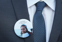 A family member wears a photo of a Boeing crash victim Danielle Moore before a hearing at federal court in Fort Worth, Texas, Sept. 3, 2025.