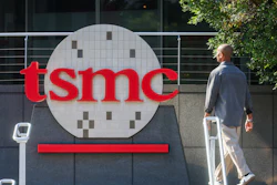A worker walks past the logo of TSMC or Taiwan Semiconductor Manufacturing Corp., a Taiwanese multinational semiconductor contract manufacturing and design company, in Hsinchu, Taiwan, on Thursday, Jan. 29, 2026.