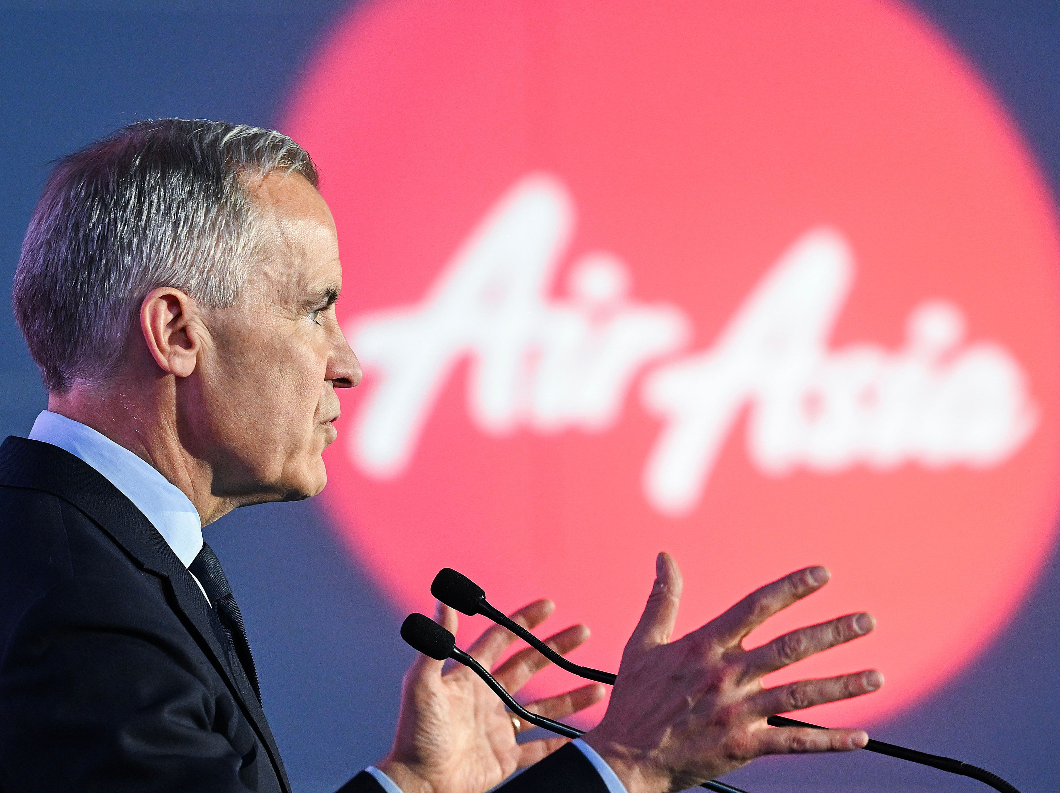 Canada's Prime Minister Mark Carney speaks during an event at the Airbus A220 Delivery Center in Mirabel, Que., Wednesday, May 6, 2026, where AirAsia placed a landmark order for 150 Airbus A220 aircraft.