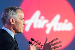 Canada's Prime Minister Mark Carney speaks during an event at the Airbus A220 Delivery Center in Mirabel, Que., Wednesday, May 6, 2026, where AirAsia placed a landmark order for 150 Airbus A220 aircraft.