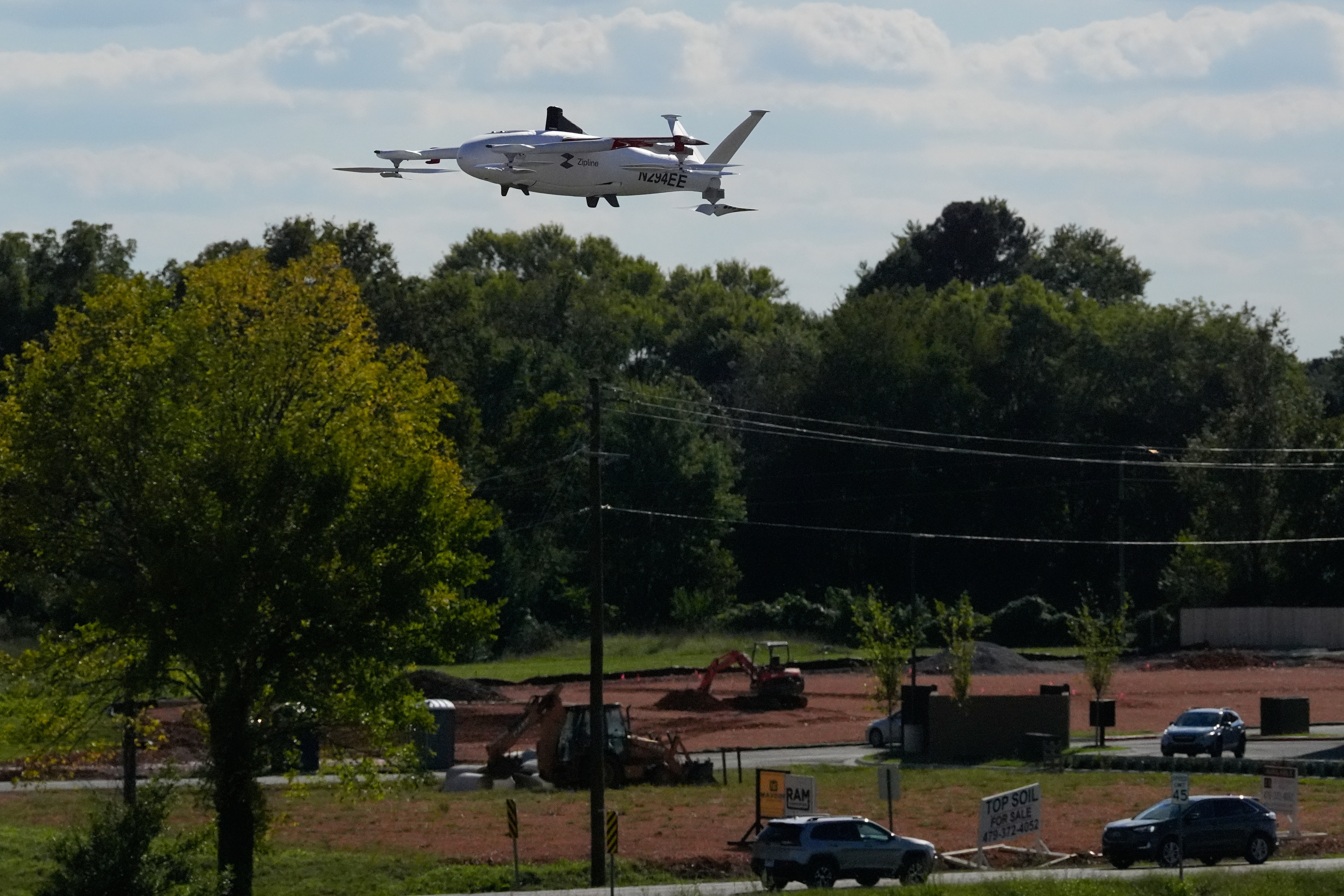 A drone operated by Zipline flies to make a delivery from a Walmart store in Pea Ridge, Ark., Friday, Sept. 26, 2025.