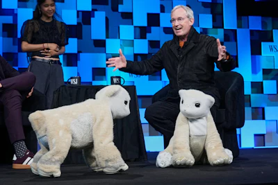 Colin Angle, longtime CEO of Roomba, unveils a four-legged prototype of artificial pets Winston, left, and Daphne, called Familiars, at The WSJ Future of Everything, in New York, Monday, May 4, 2026.
