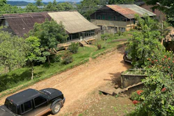 This photo provided by the Brazilian Federal Justice shows a truck driving past buildings in Fordlandia, Para, Brazil, Dec. 6, 2021.