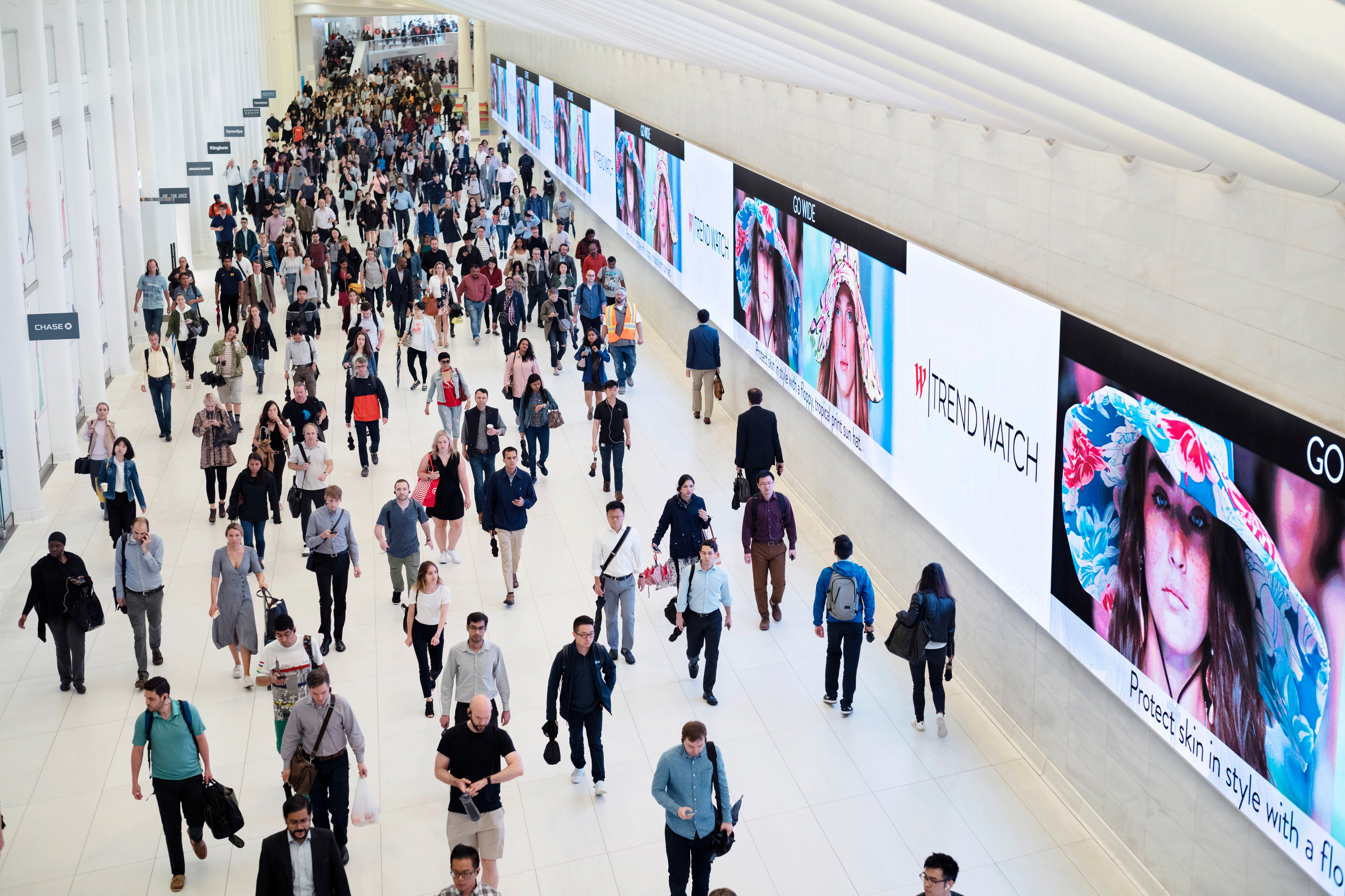 Commuters walk through a corridor in the World Trade Center Transportation Hub in New York on June 21, 2019.