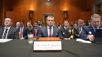 Acting Under Secretary of Defense and Comptroller Jules Hurst III, Defense Secretary Pete Hegseth and Chairman of the Joint Chiefs of Staff Gen. Dan Caine arrive to testify at a Senate Appropriations subcommittee on defense hearing on the budget request for the Department of Defense, Tuesday, May 12, 2026, in Washington.