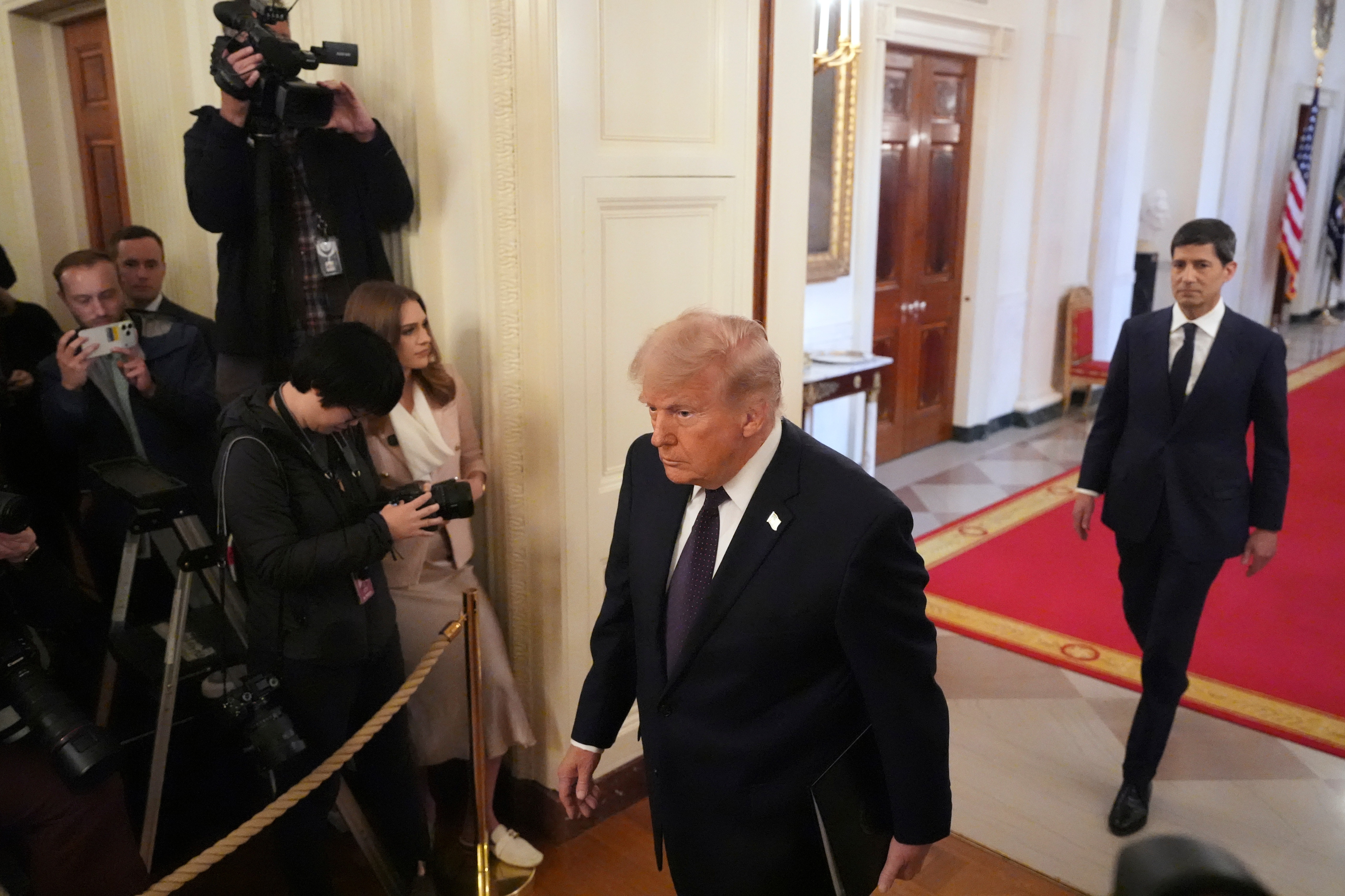 President Donald Trump and Kevin Warsh arrive at Warsh's swearing-in ceremony as Fed chair, May 22, 2026.