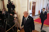 President Donald Trump and Kevin Warsh arrive at Warsh's swearing-in ceremony as Fed chair, May 22, 2026.