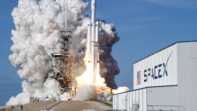 A Falcon 9 SpaceX heavy rocket lifts off from pad 39A at the Kennedy Space Center in Cape Canaveral, Fla., Tuesday, Feb. 6, 2018.