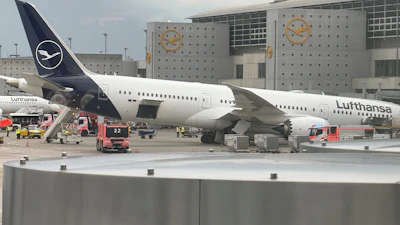 A Lufthansa 'Dreamliner ' aircraft lies on its nose in front of a terminal at Frankfurt Airport after the nose landing gear collapsed on Thursday, June 4, 2026 in Frankfurt, Germany.