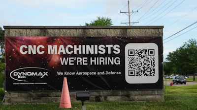 A hiring sign is seen outside of a company in Wheeling, Ill., Monday, June 8, 2026.