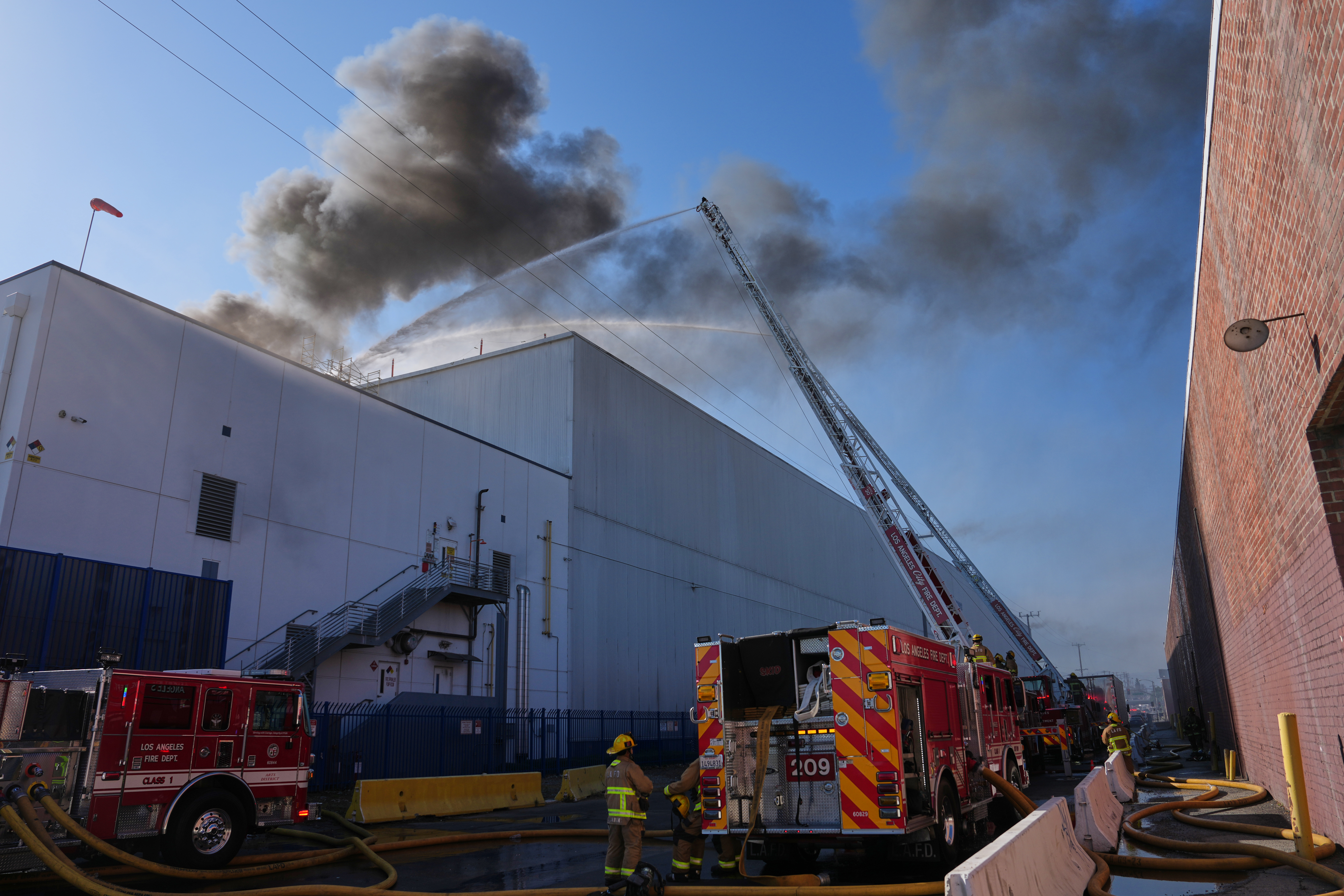 Crews work a warehouse fire in the Boyle Heights section of Los Angeles, June 17, 2026.