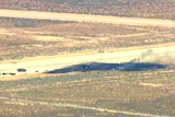 This image taken from video provided by KABC shows law enforcement responding to the scene of an aircraft crash, Monday, June 15, 2026, near Edwards Air Force Base, Calif.