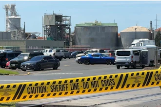 Yellow police tape is seen on May 27, 2026 outside the Longview, Wash. paper mill where a deadly chemical tank failure occurred.