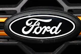 The company logo is shown on the grille of an unsold 2026 F-series pickup truck on the lot of a Ford dealership Sunday, Nov. 2, 2025, in Littleton, Colo.