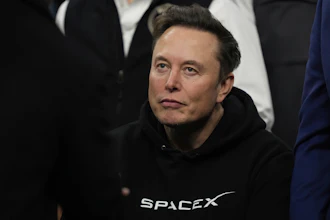 Elon Musk attends the finals for the NCAA wrestling championship, March 22, 2025, in Philadelphia.