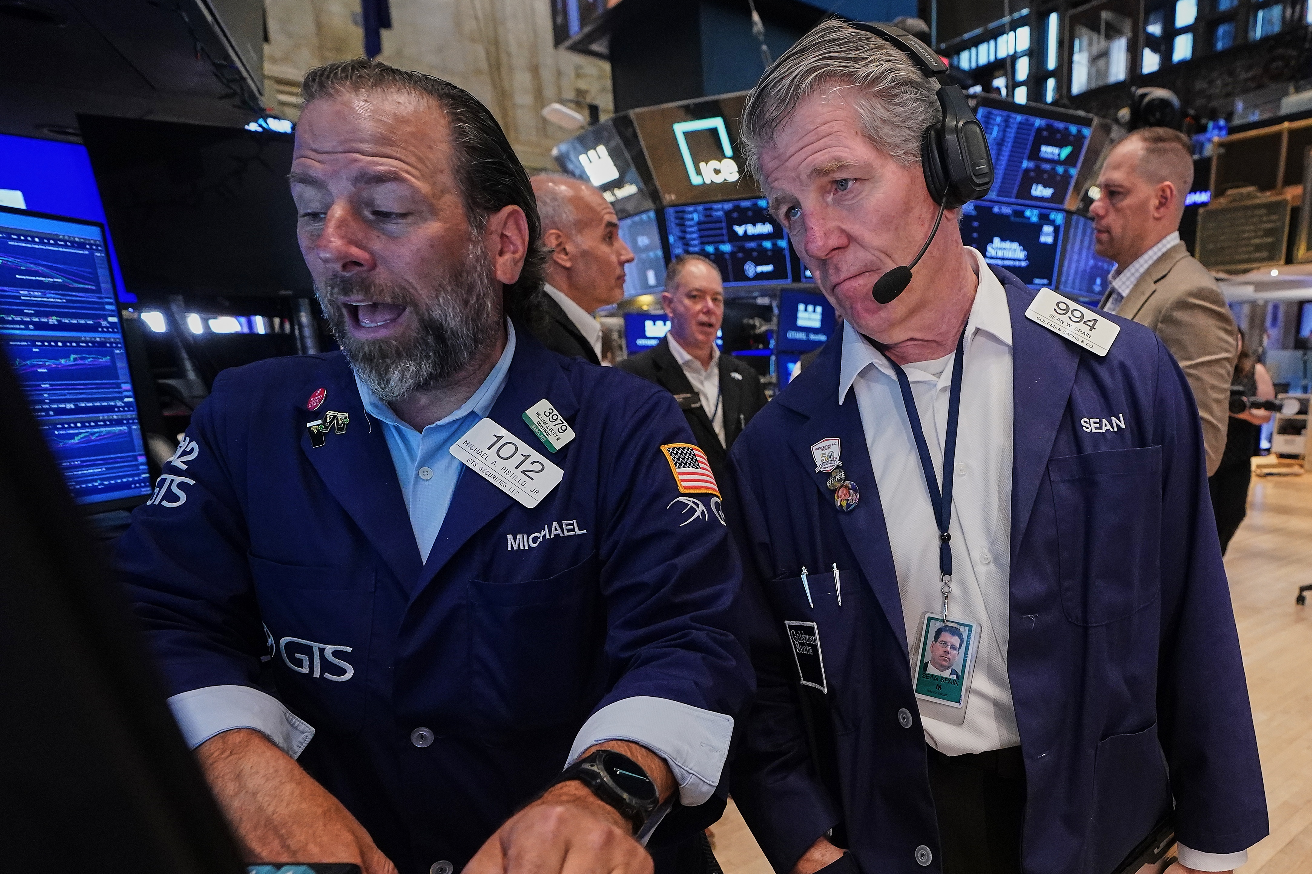 Specialist Michael Pistillo, left, and trader Sean Spain work on the floor of the New York Stock Exchange, Tuesday, June 16, 2026.