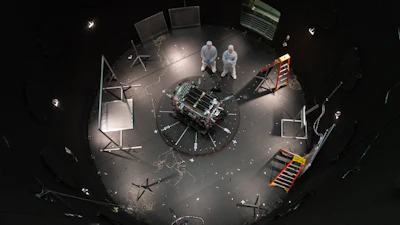 This photo provided by NASA shows Kieran Wilson, LINK’s principal investigator, and Hunter Robertson, a space systems engineer, both at Katalyst Space, standing next to their spacecraft inside the SES (Space Environment Simulator) at NASA’s Goddard Space Flight Center in Greenbelt, Md., April 17, 2026, ahead of thermal vacuum testing.