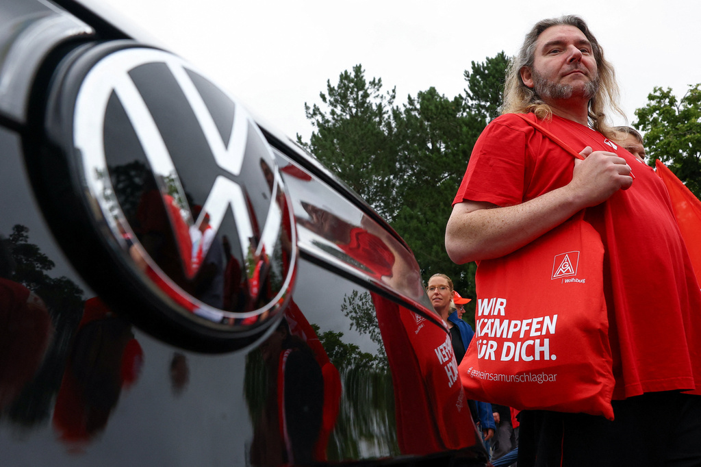 Employees of carmaker Volkswagen AG and IG Metall union members rally on the grounds of the Volkswagen headquarters on the day of the supervisory board meeting, in Wolfsburg, Germany, Thursday, July 9, 2026.