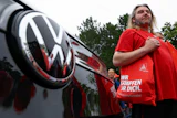 Employees of carmaker Volkswagen AG and IG Metall union members rally on the grounds of the Volkswagen headquarters on the day of the supervisory board meeting, in Wolfsburg, Germany, Thursday, July 9, 2026.