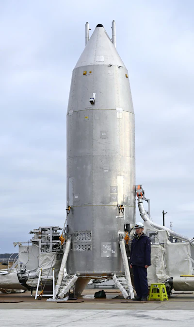 This photo shows the Reusable Vehicle eXperiment, known as RV-X, at the Noshiro Rocket Testing Center of the Japan Aerospace Exploration Agency, in Noshiro, northern Japan, March 14, 2026.