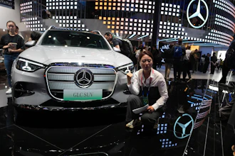 A vlogger promotes the GLC SUV at the Mercedes-Benz booth during Auto China 2026 in Beijing, on April 24, 2026. Major German carmakers saw sharp quarterly sales declines in China, as domestic demand weakened and competition heats up in the world’s biggest auto market.