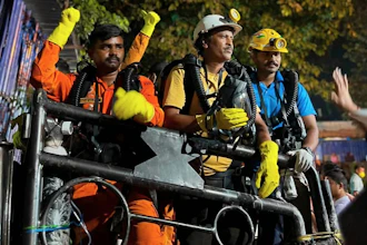 In this image provided by the Information and Public Relations Department, Government of Sikkim, rescue workers stand outside an under-construction tunnel at a hydropower project in Samardung village, about 40 kilometers (25 miles) from Gangtok, India, Wednesday, July 22, 2026.