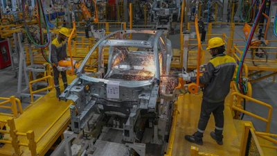Workers assemble a car at the VinFast electric vehicle plant in Thoothukudi, in the southern Indian state of Tamil Nadu, Monday, Aug. 4, 2025.
