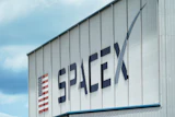 The SpaceX logo is displayed on a building, May 26, 2020, at the Kennedy Space Center in Cape Canaveral, Fla.