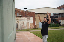 Wesley Mast, owner and president of Coppes Napanee, gestures next to a giant replica of a Hoosier cabinet (see below) in Nappanee, Ind., Thursday, Aug. 6, 2026.
