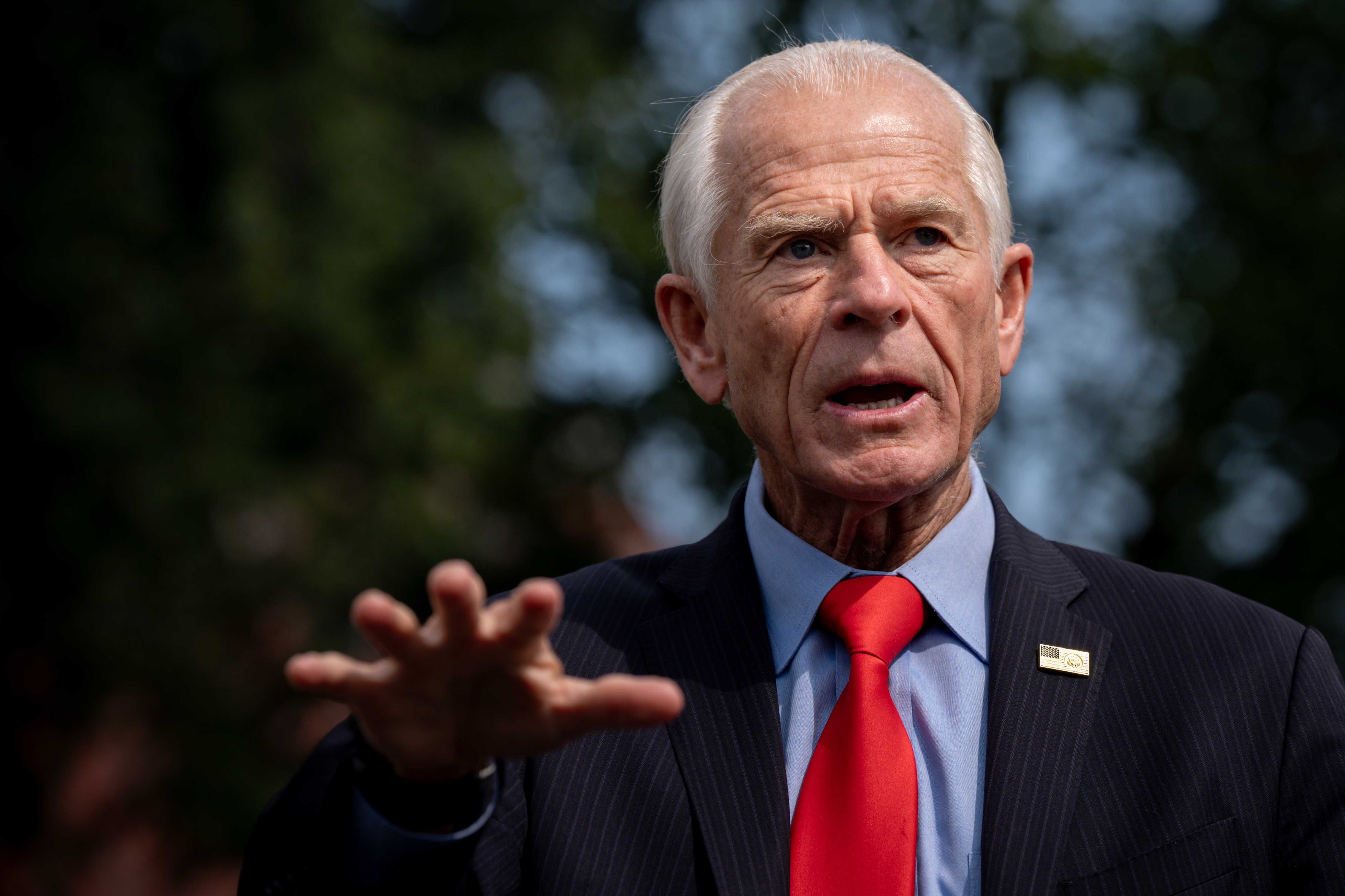 White House trade counselor Peter Navarro speaks with reporters outside the White House, Aug. 11, 2026.
