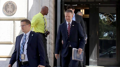 United States Trade Representative Jamieson Greer, center, leaves the U.S. Department of Commerce following a meeting with Canadian officials, Aug. 17, 2026.