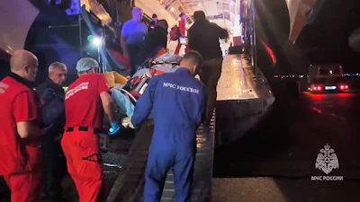 In this image made from video provided by Russian Emergency Situations Ministry press service, medical and rescue workers put those injured in a fire at the Amur Gas Chemical Complex on a plane to Moscow in Blagoveschensk, Amur region, Russia, Thursday, Aug. 27, 2026.