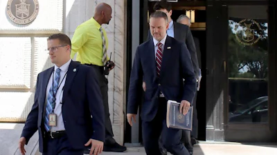 United States Trade Representative Jamieson Greer, center, leaves the U.S. Department of Commerce following a meeting with Canadian officials, in Washington, Monday, Aug. 17, 2026.